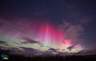Red Aurora between the clouds